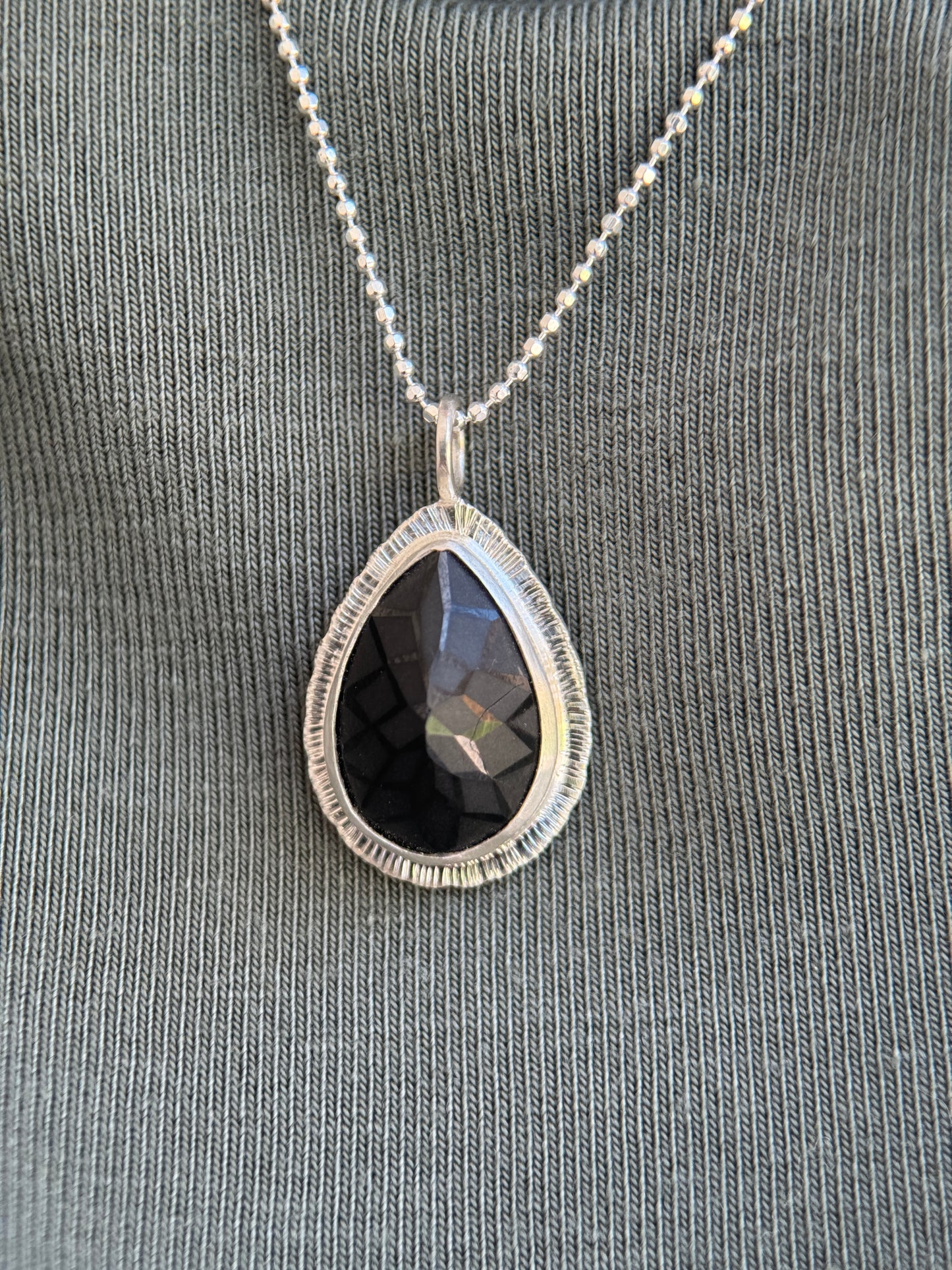 Laser carved black Spinel pendant