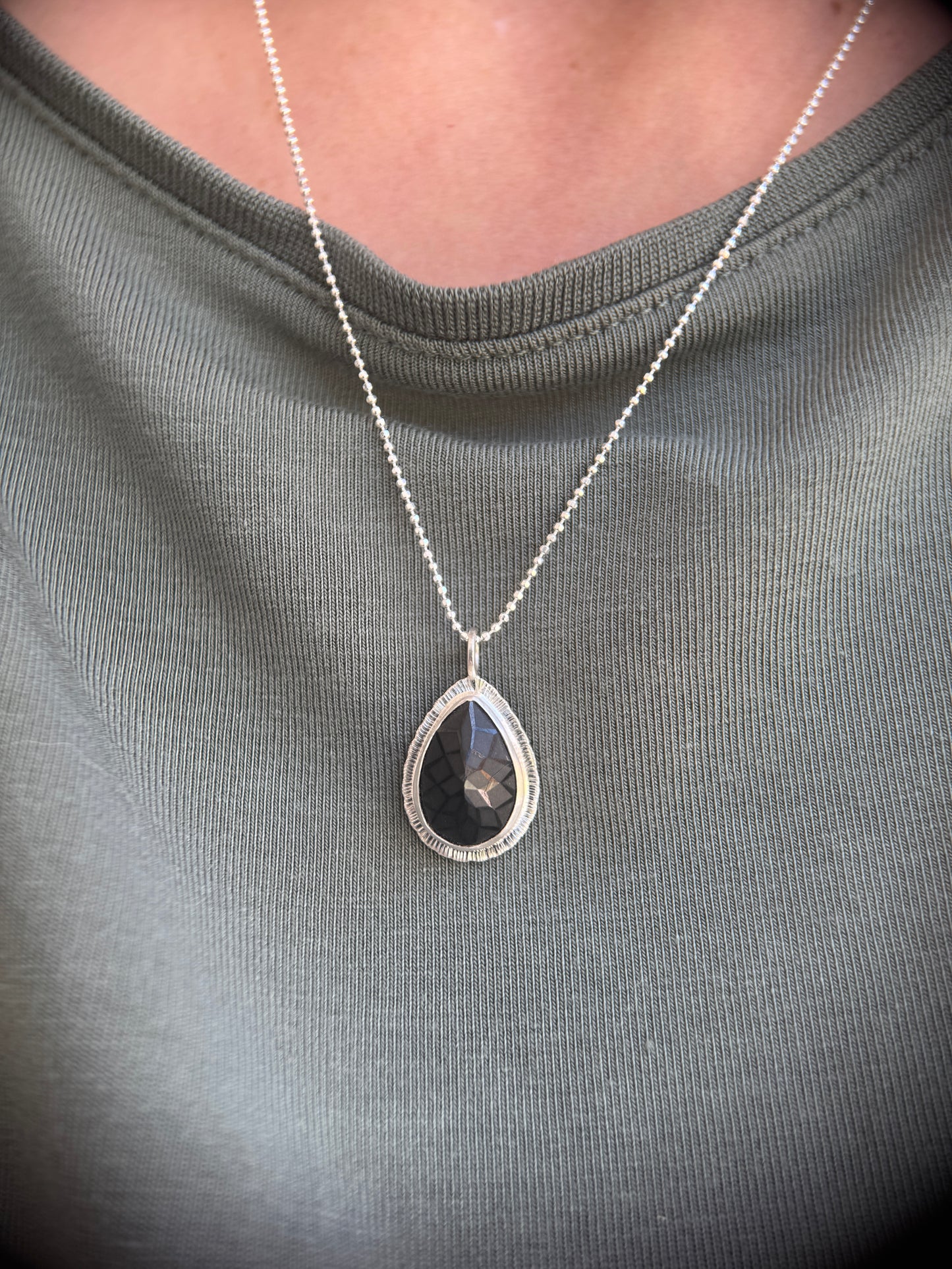 Laser carved black Spinel pendant