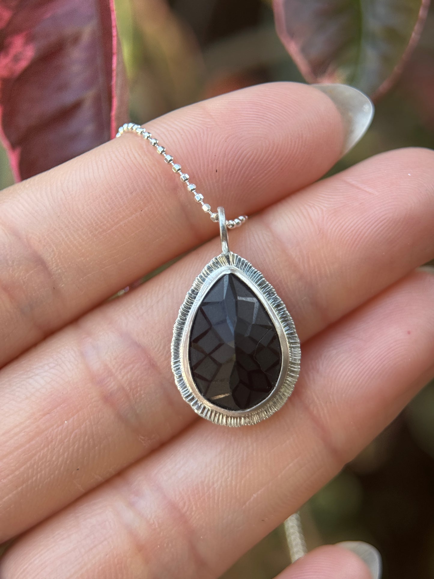 Laser carved black Spinel pendant