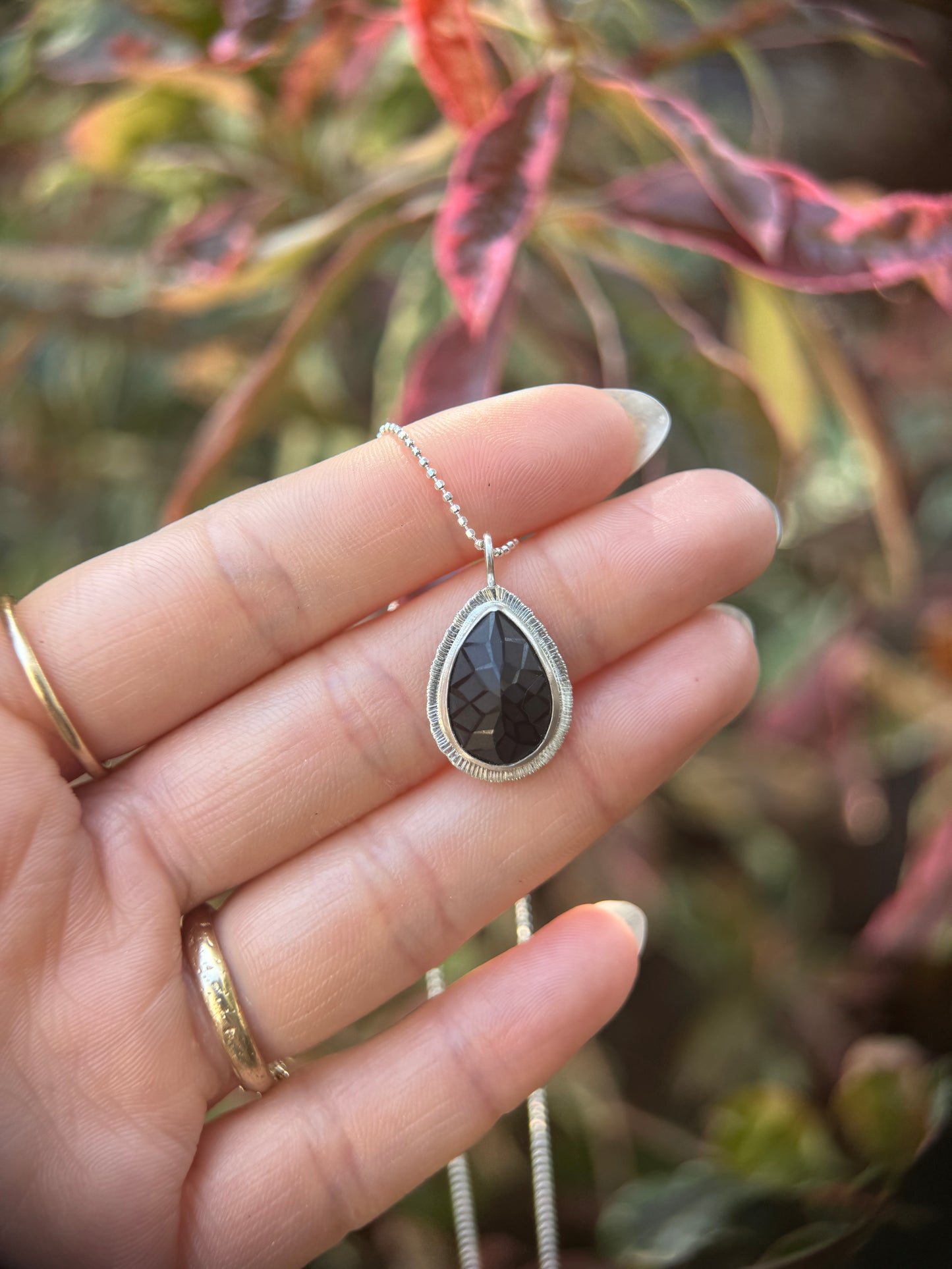 Laser carved black Spinel pendant