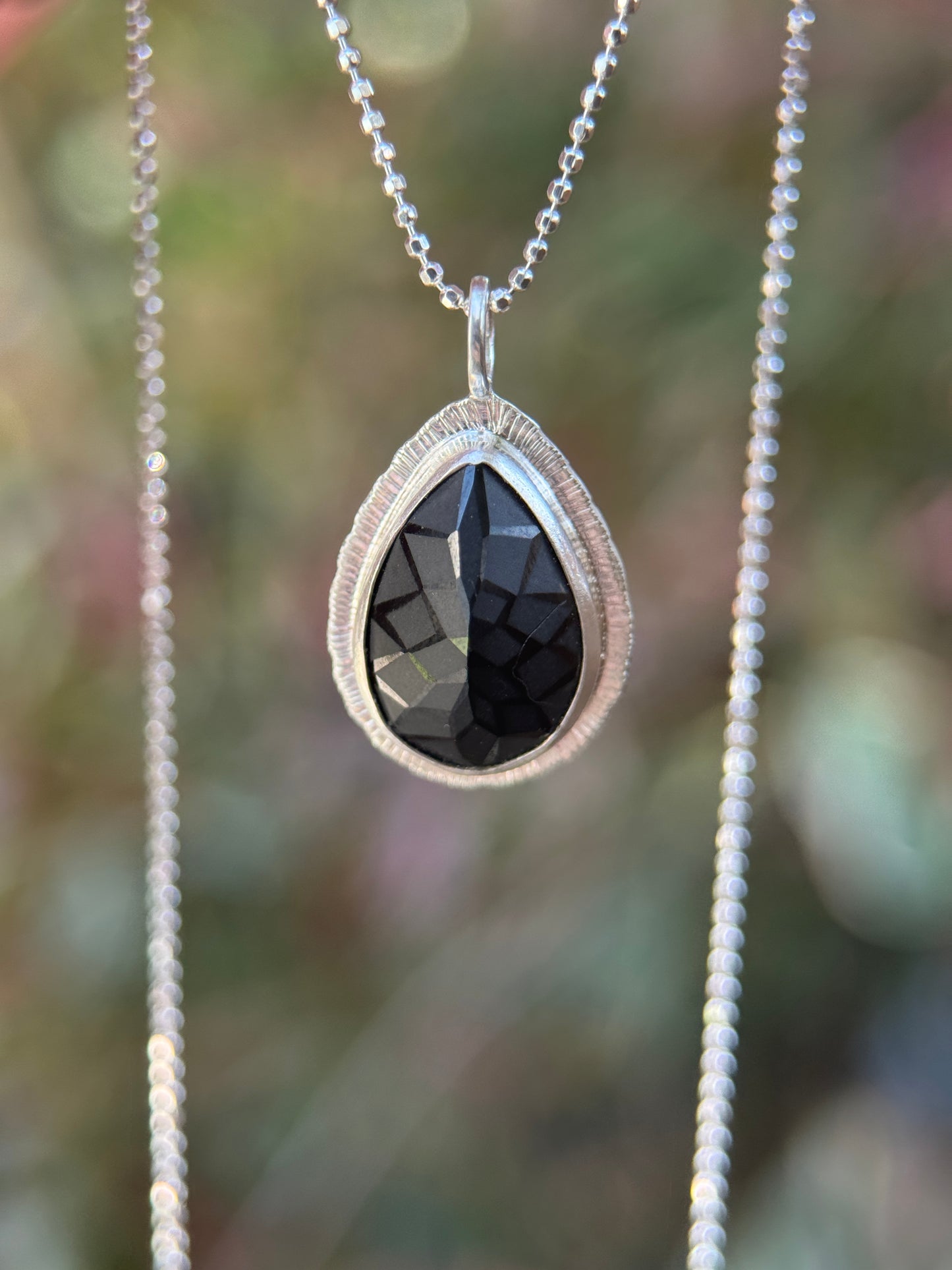 Laser carved black Spinel pendant