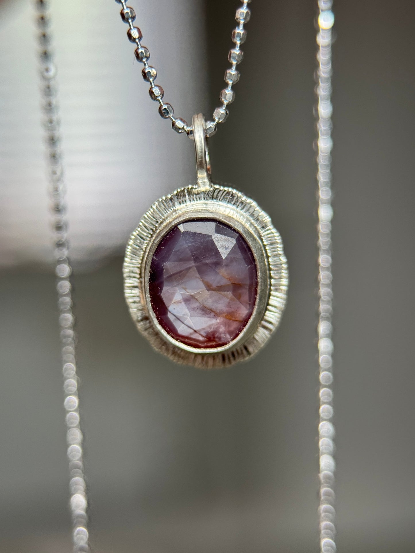 Rose cut silky plum Sapphire pendant