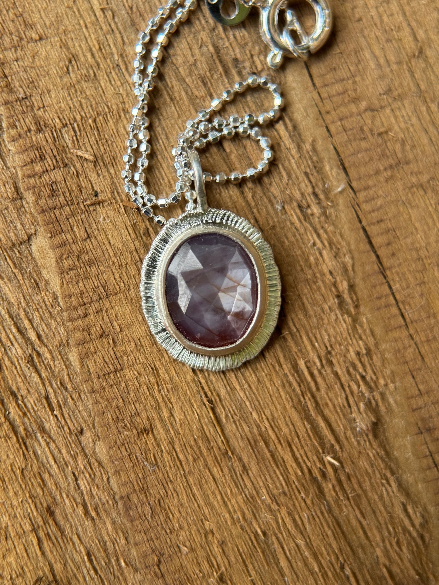 Rose cut silky plum Sapphire pendant