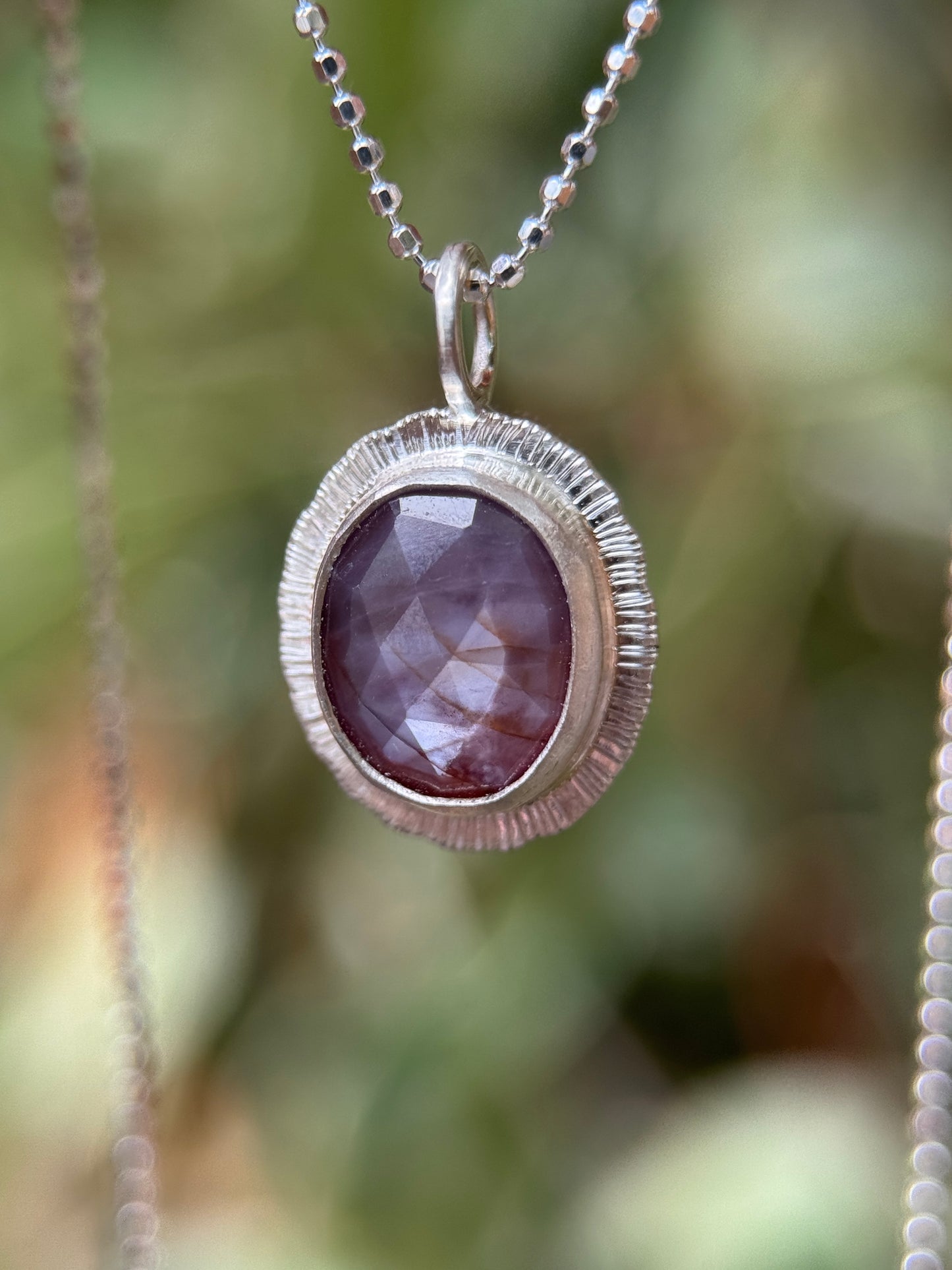Rose cut silky plum Sapphire pendant