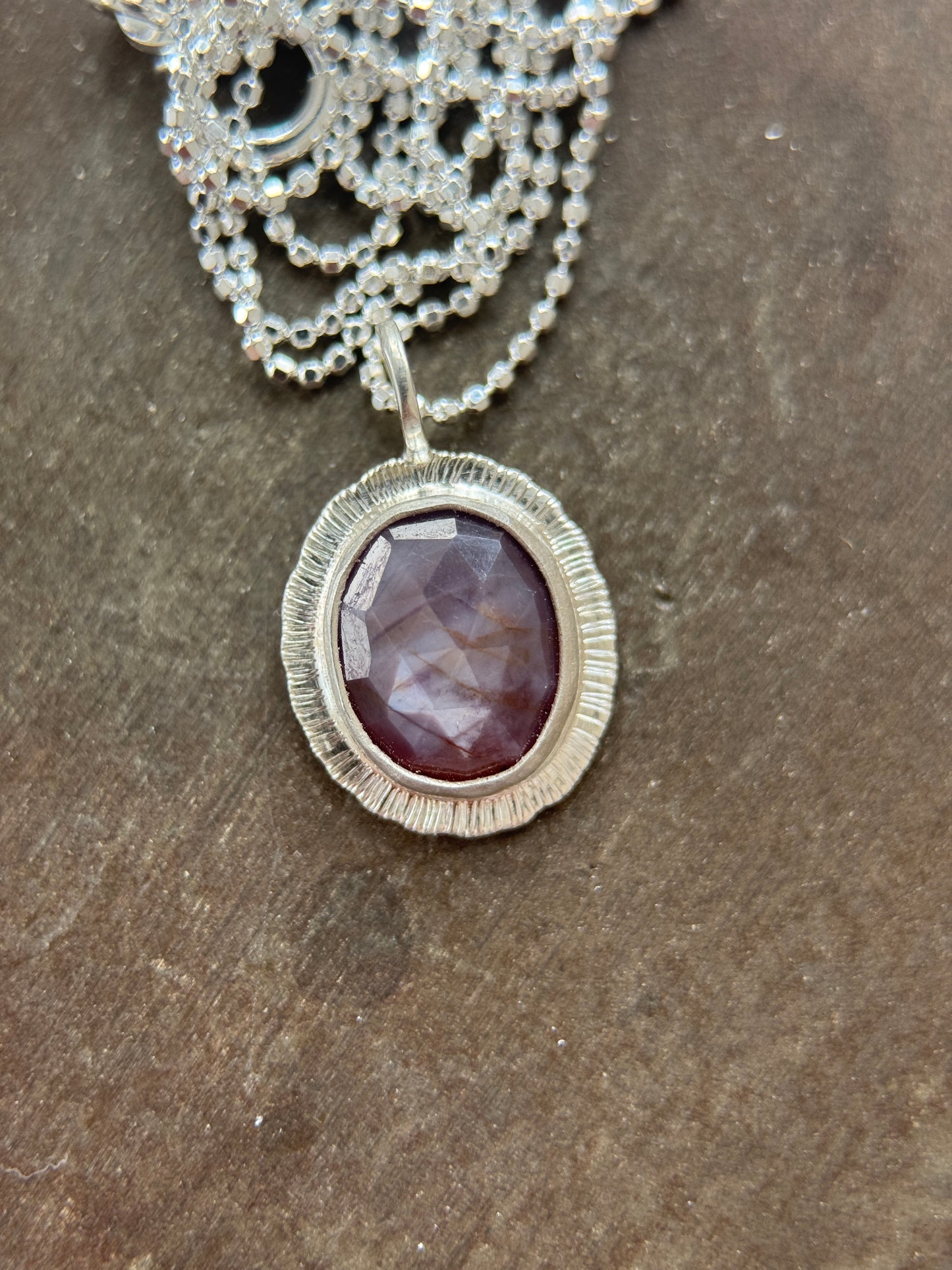 Rose cut silky plum Sapphire pendant