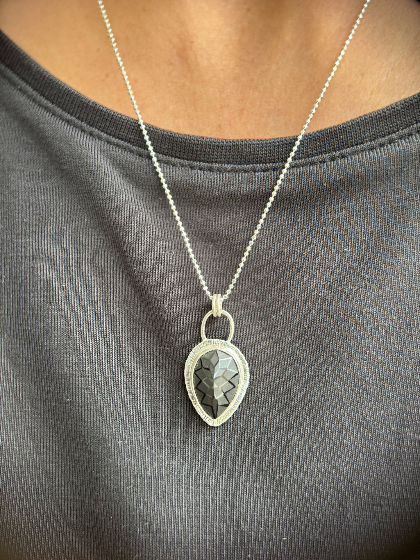 Laser carved black Spinel pendant