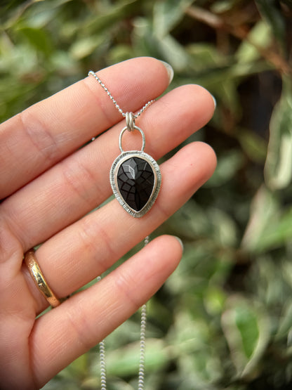 Laser carved black Spinel pendant