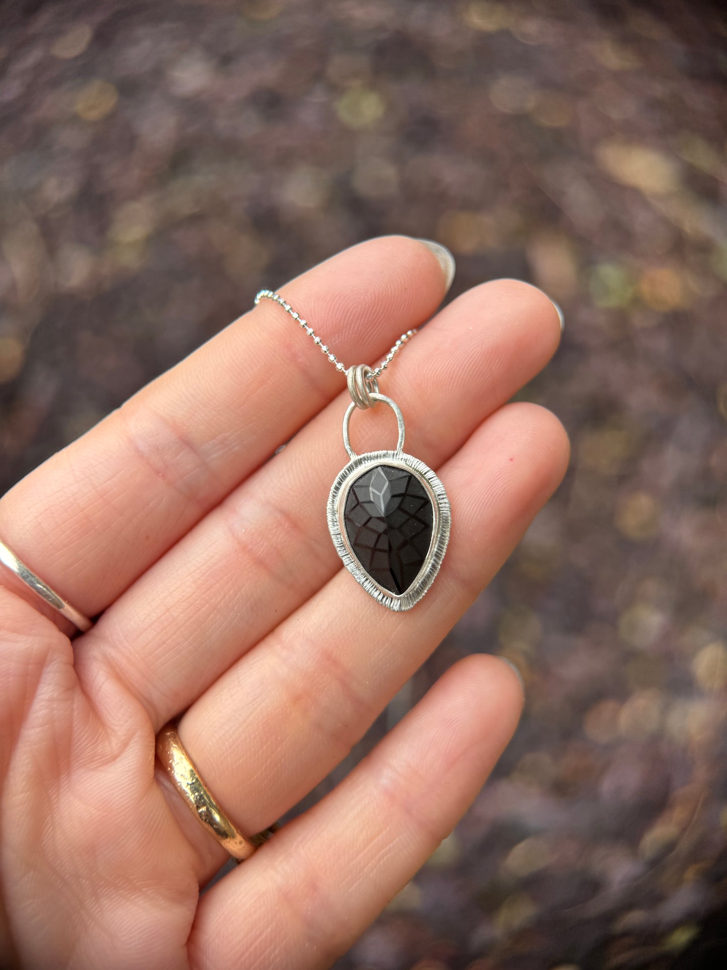 Laser carved black Spinel pendant