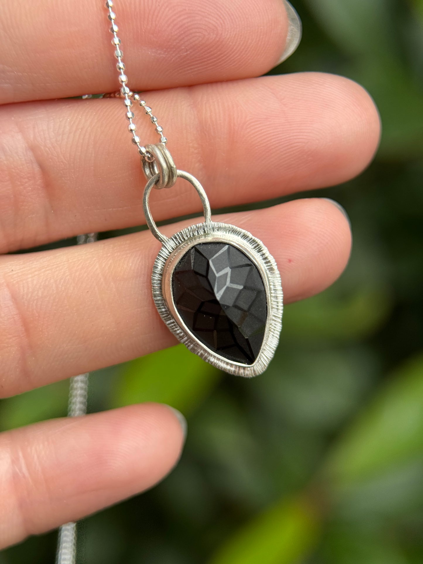 Laser carved black Spinel pendant