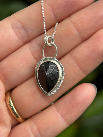 Laser carved black Spinel pendant