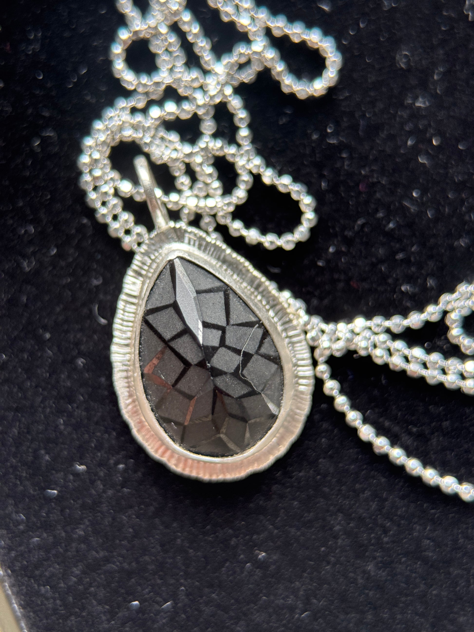 Laser carved black Spinel pendant