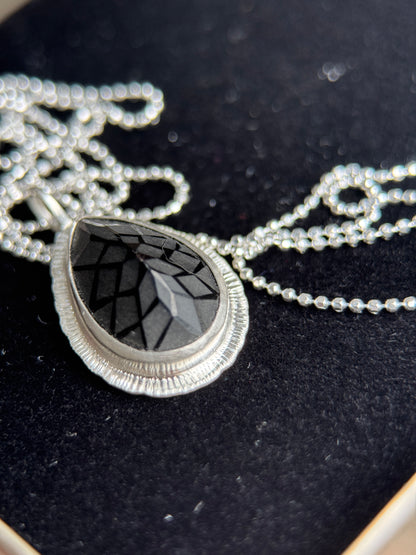 Laser carved black Spinel pendant