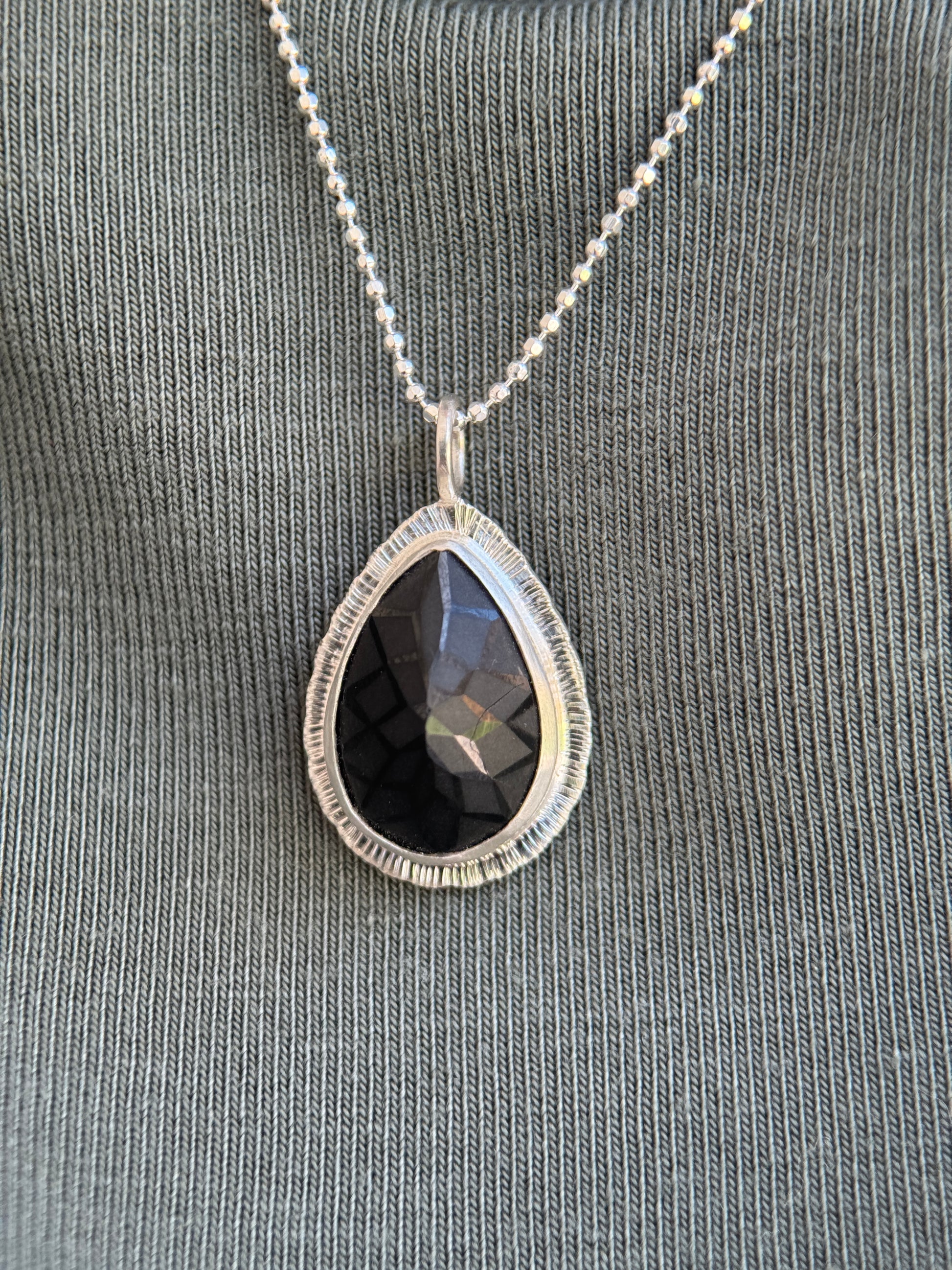 Laser carved black Spinel pendant