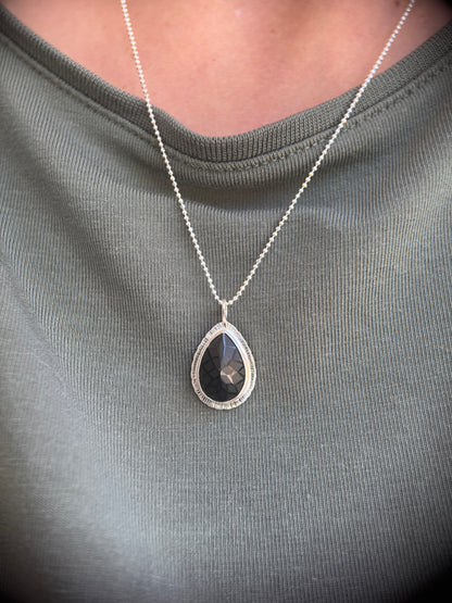 Laser carved black Spinel pendant
