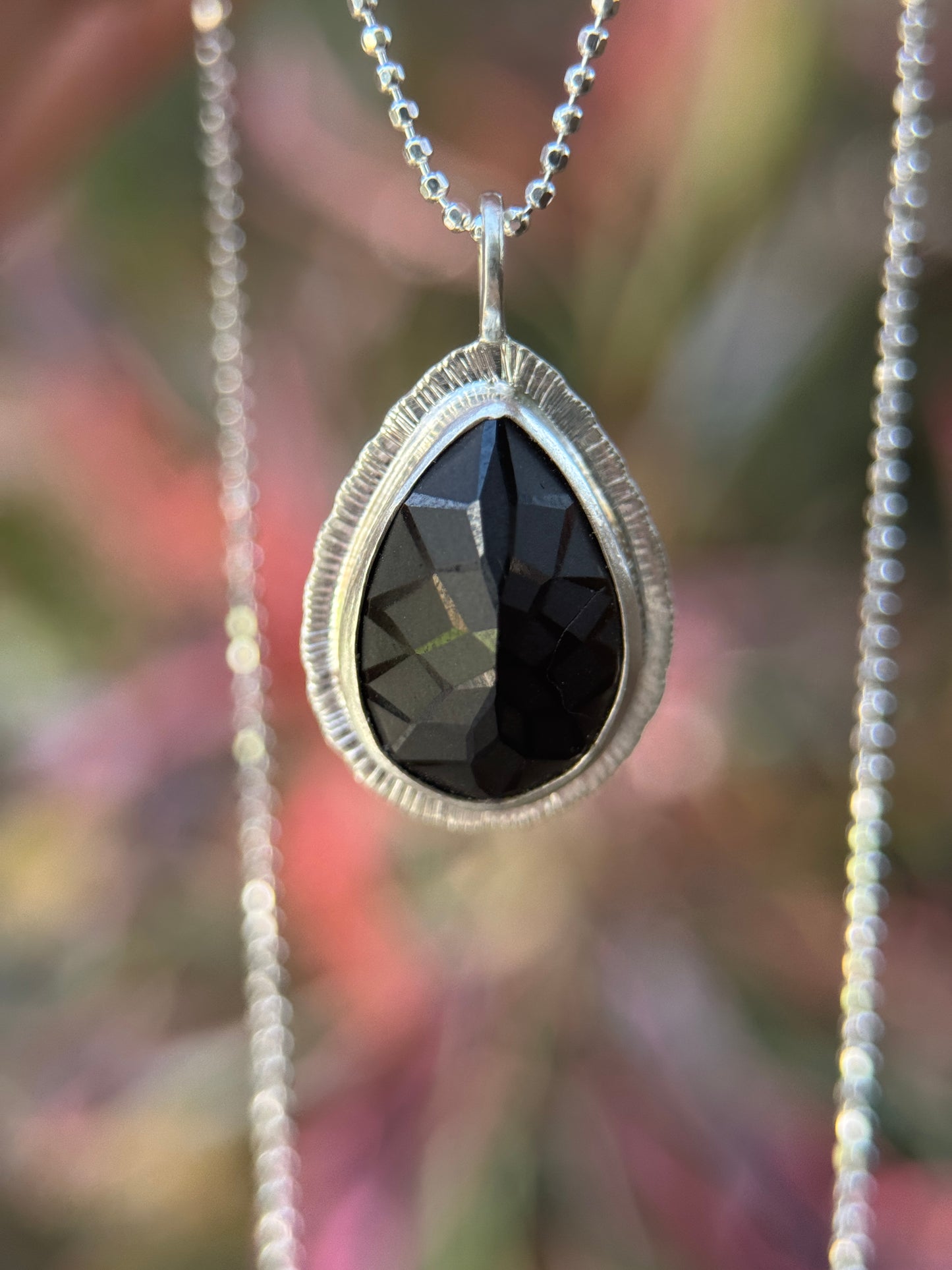 Laser carved black Spinel pendant