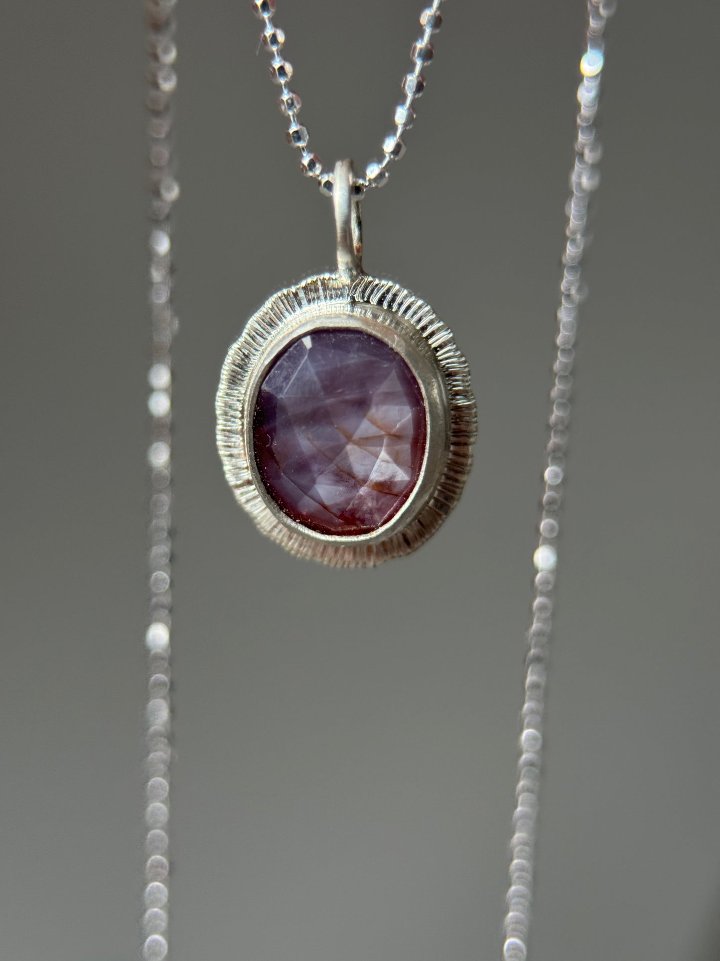 Rose cut silky plum Sapphire pendant