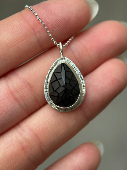 Laser carved black Spinel pendant