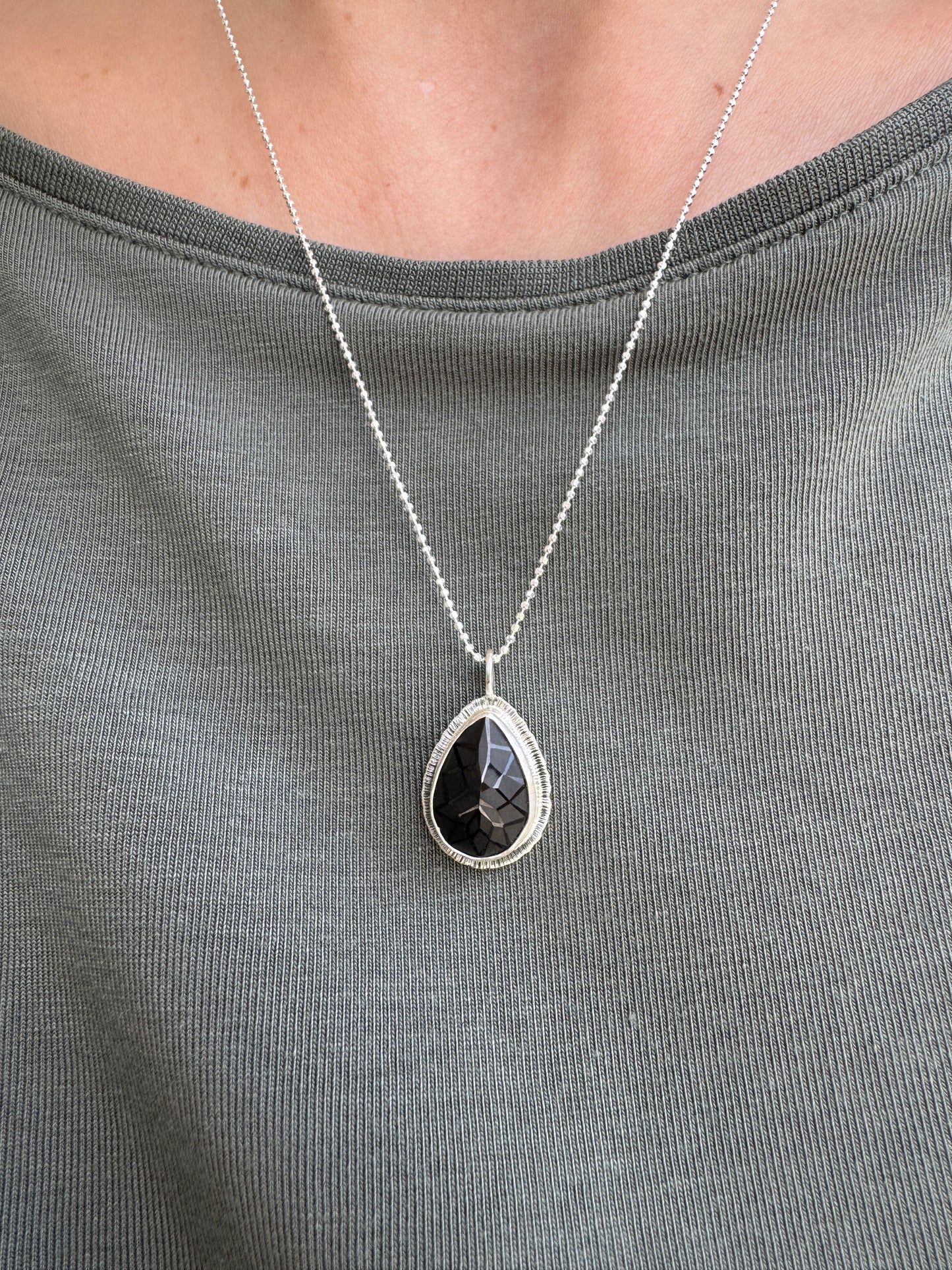 Laser carved black Spinel pendant