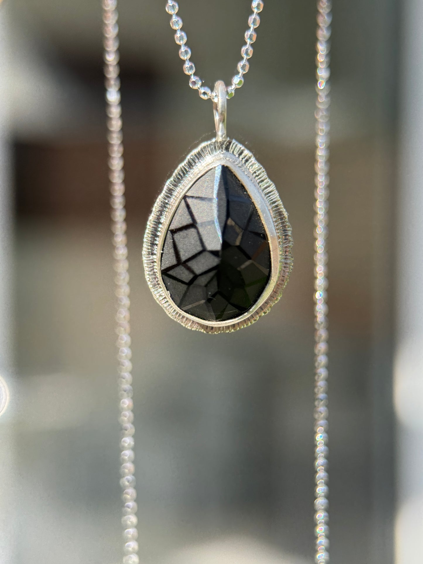 Laser carved black Spinel pendant