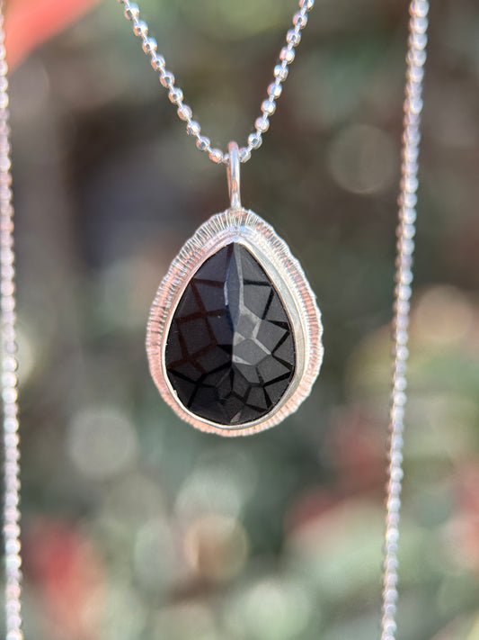 Laser carved black Spinel pendant