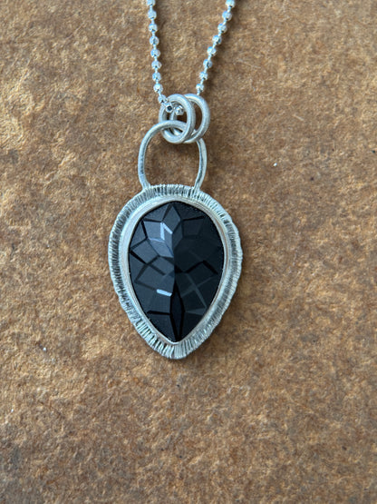 Laser carved black Spinel pendant