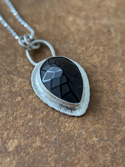 Laser carved black Spinel pendant
