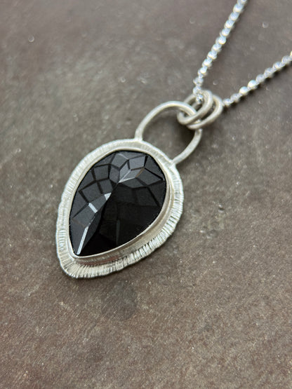 Laser carved black Spinel pendant