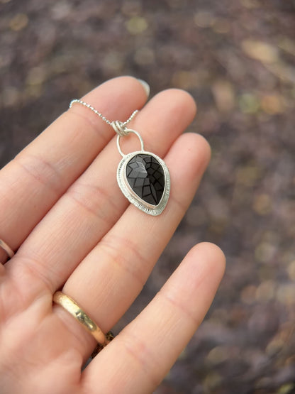 Laser carved black Spinel pendant