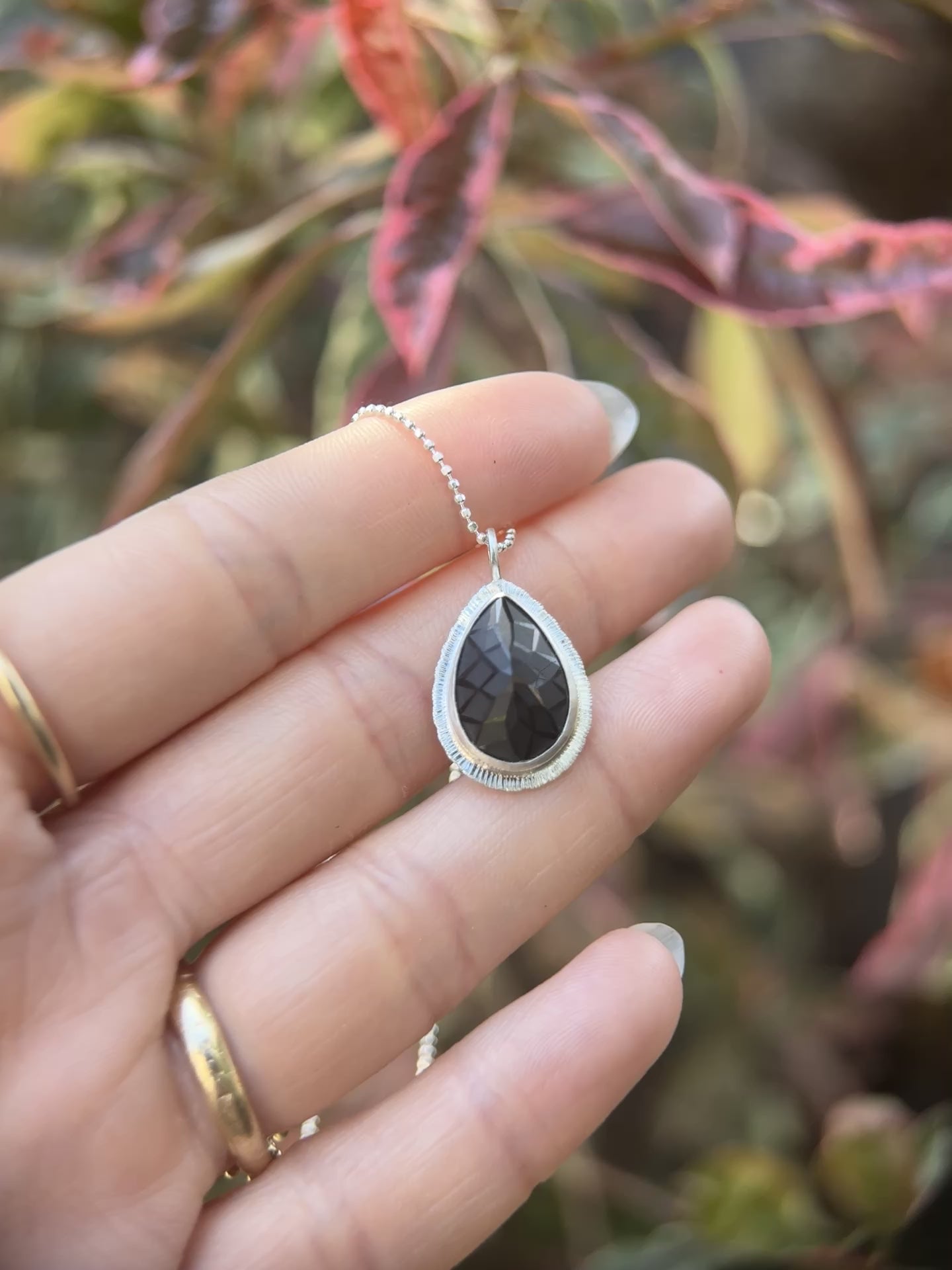 Laser carved black Spinel pendant