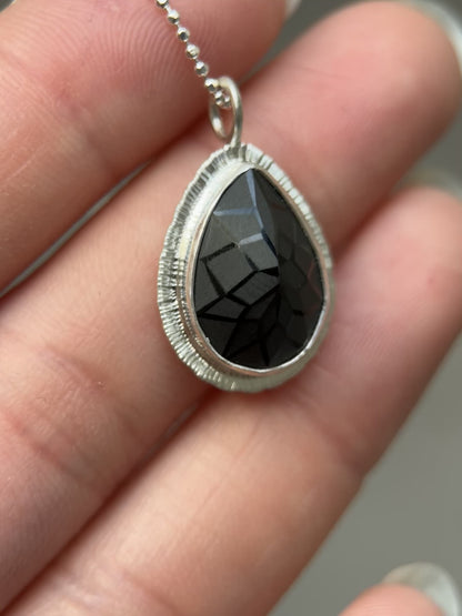 Laser carved black Spinel pendant